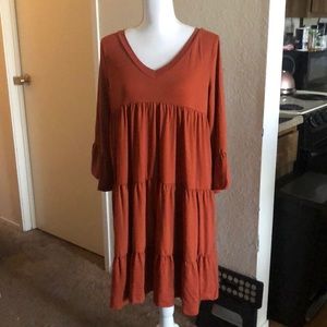 Ruffled midi dress in Rust.